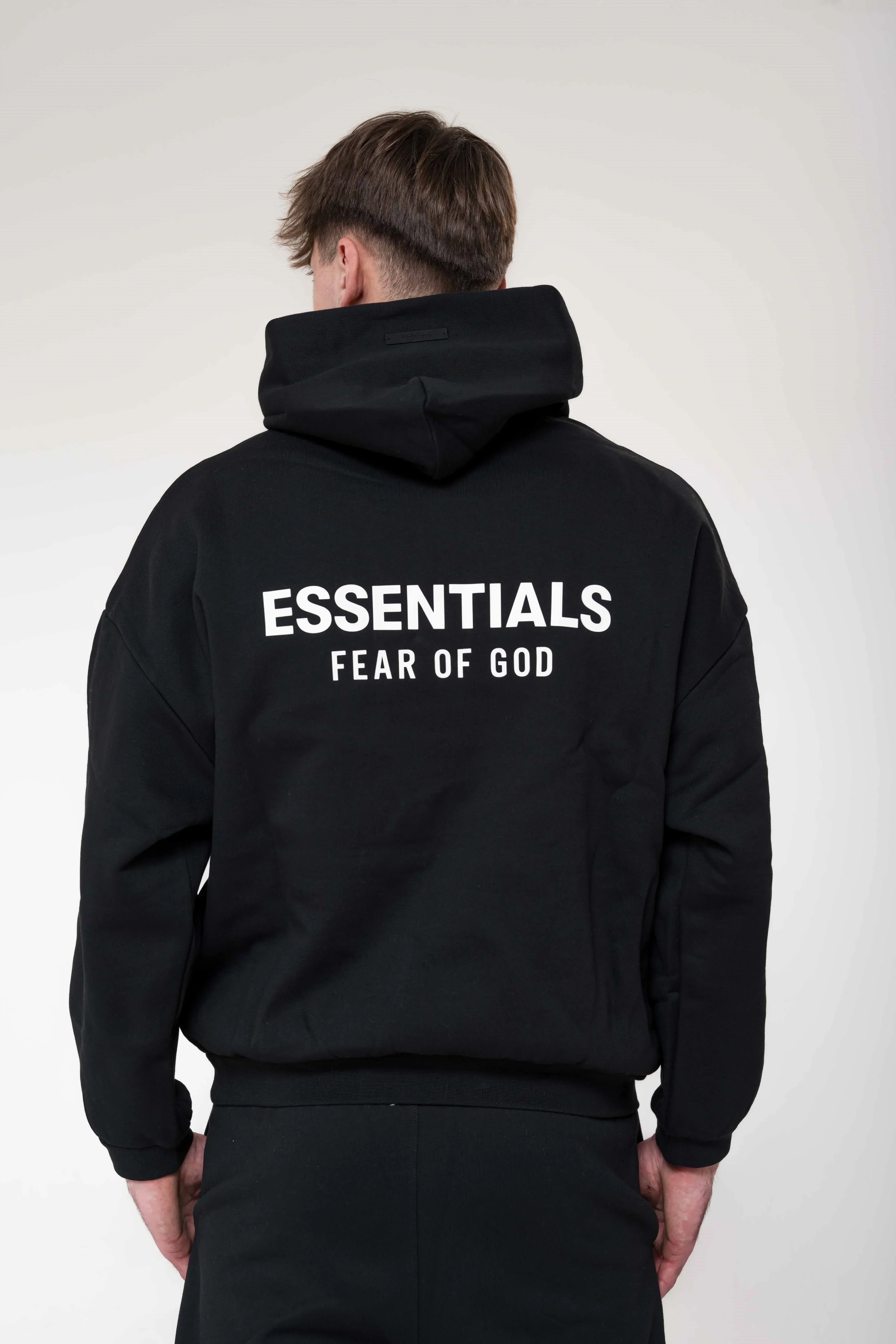Fear of God Essentials Fleece Black Hoodie back view