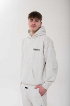Fear of God Essentials Light Oatmeal Hoodie front view