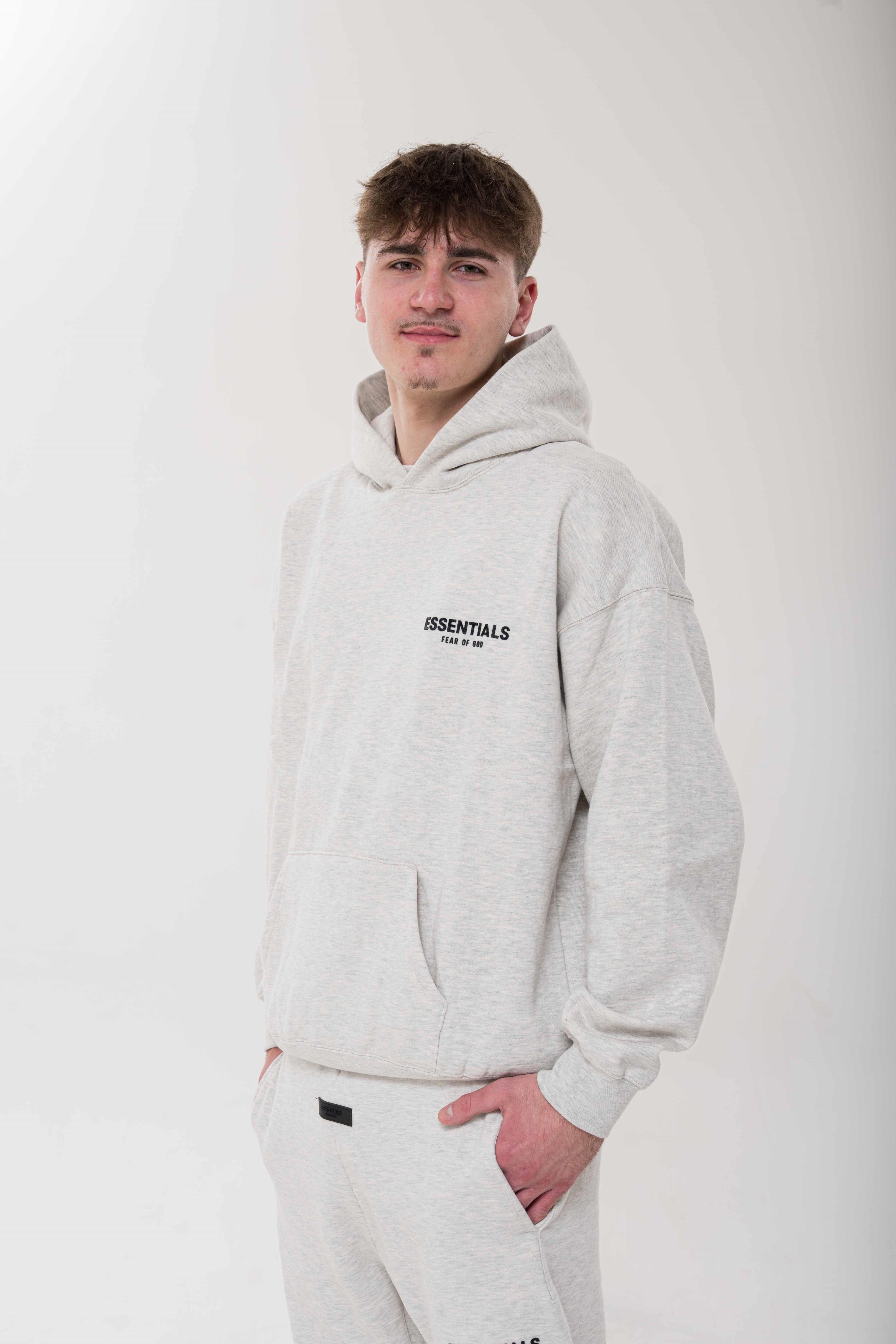Fear of God Essentials Light Oatmeal Hoodie front view