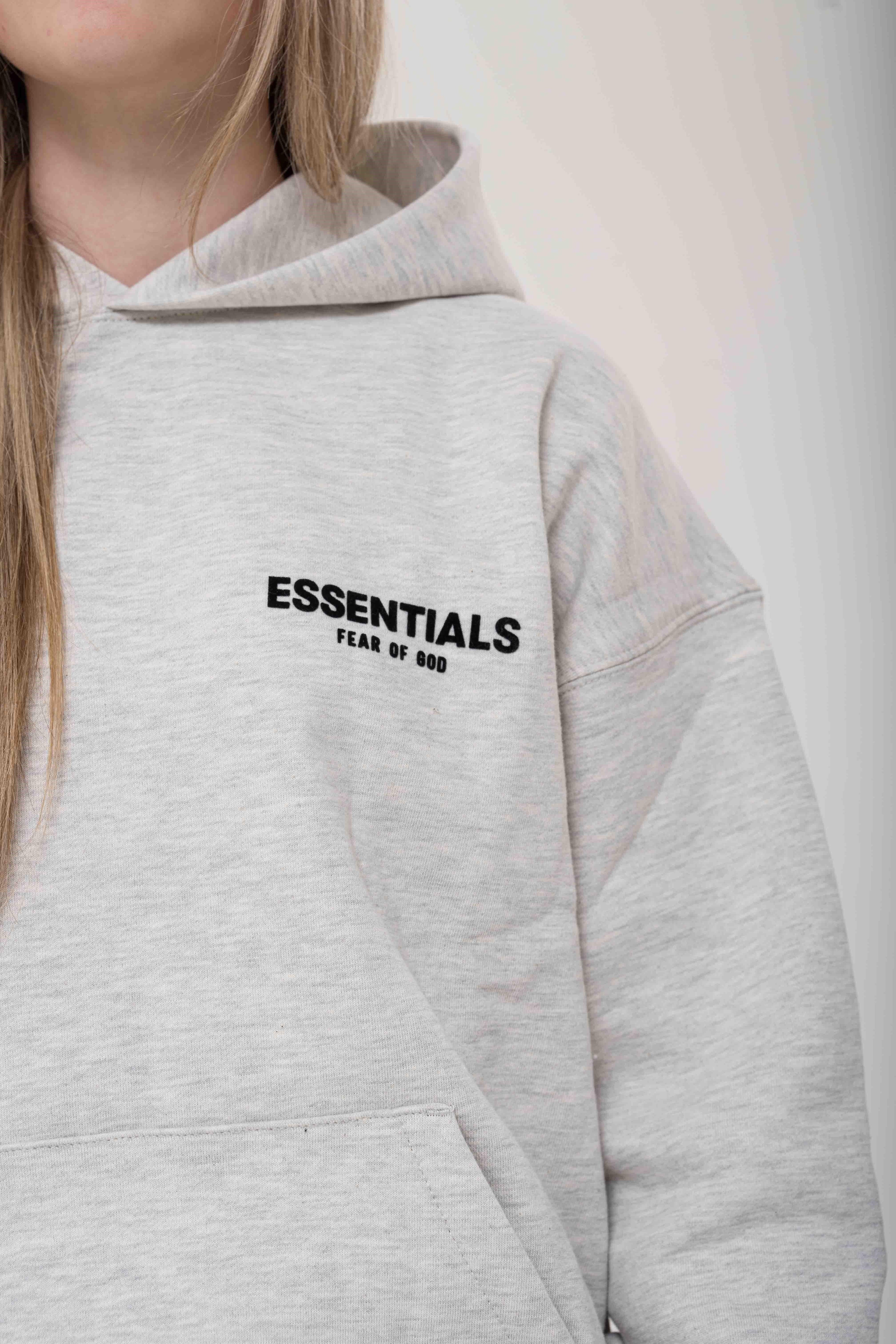 Fear of God Essentials Light Oatmeal Hoodie logo detail